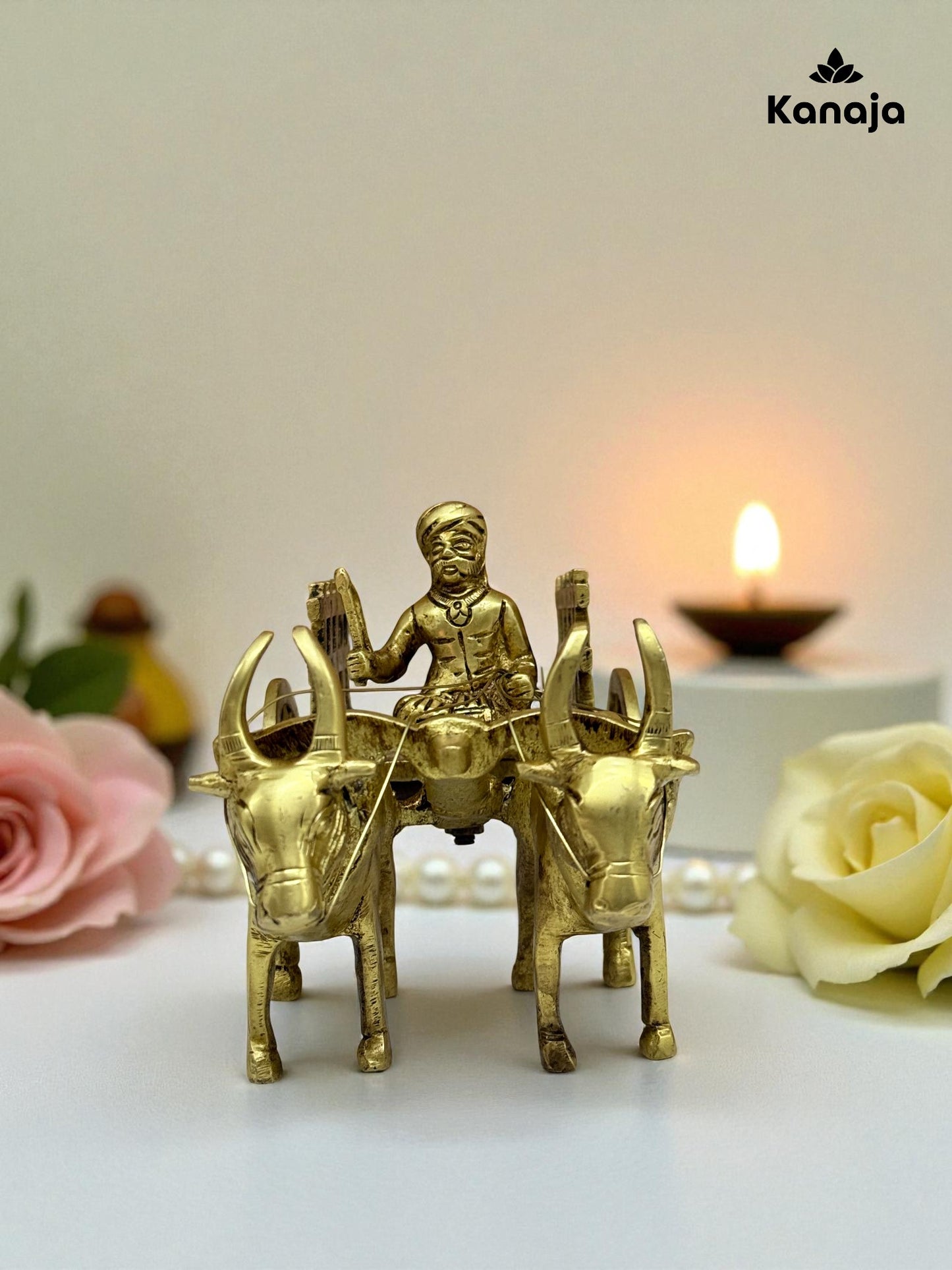 Golden Bullock Cart with Rider Statue - A Glimpse into Rustic Charm