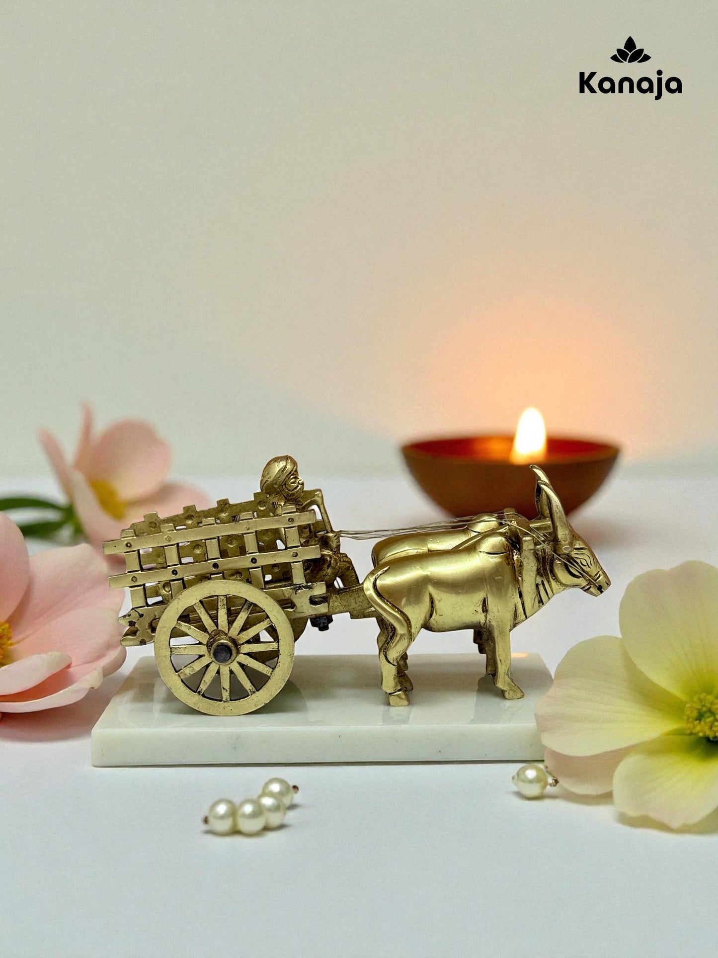 Golden Bullock Cart with Rider Statue - A Glimpse into Rustic Charm